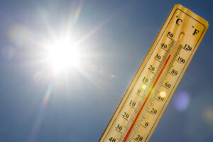 Mercury thermometer marking 39 degrees Celsius 100 Fahrenheit in a sunny day. Oklahoma City Pool Contractor 